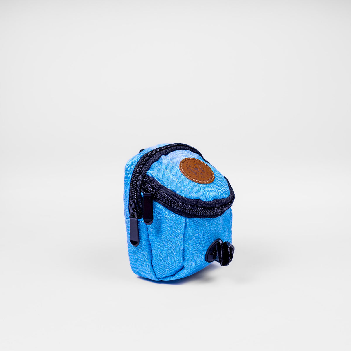 Blue pouch with a brown label on a white background